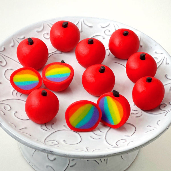 rosh hashanah rainbow apple truffles on a pedestal closeup
