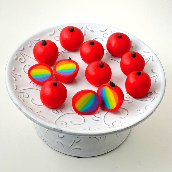 rosh hashanah rainbow apple truffles on a pedestal