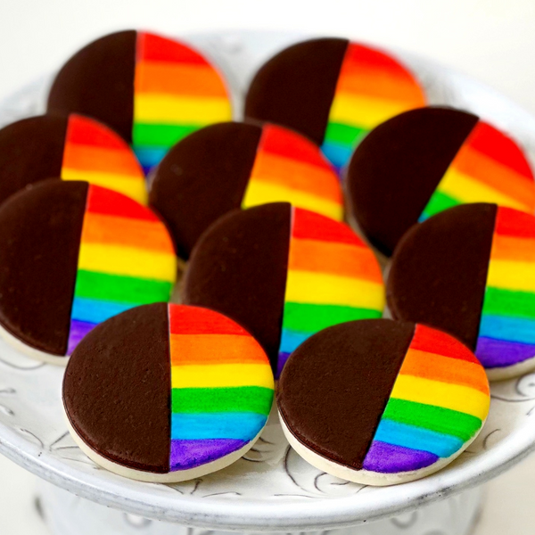 pride rainbow black & white cookies on a plate closeup