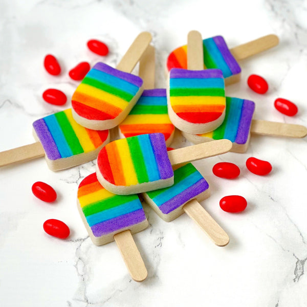 rainbow ice popsicles marzipan candy lollipops with real sticks in a pile