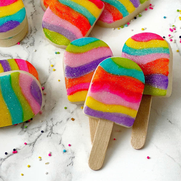 fantasy rainbow glitter candy marzipan popsicles closeup
