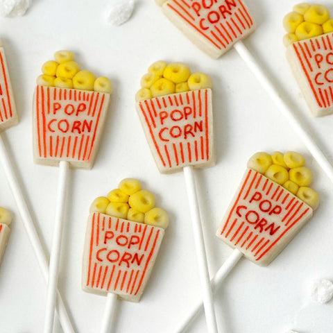 movie popcorn box marzipan candy lollipops closeup