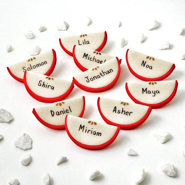 rosh hashanah personalized marzipan apple slices dinner table settings closeup layout
