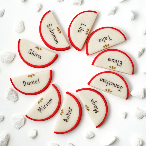 rosh hashanah personalized marzipan apple slices dinner table settings in a circle