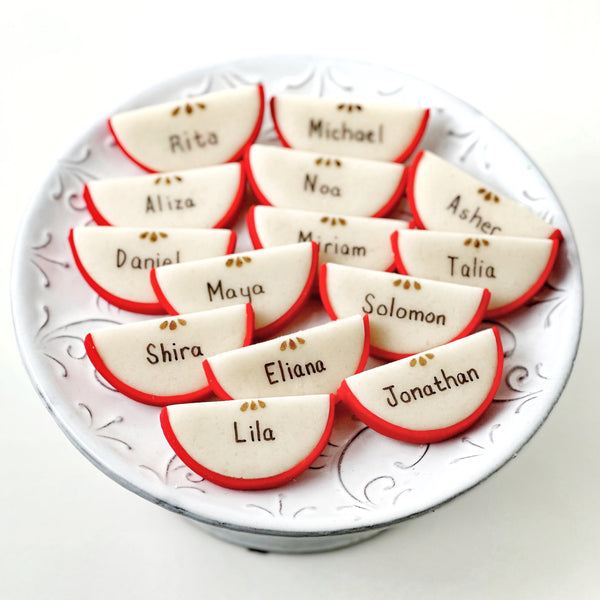 rosh hashanah personalized marzipan apple slices dinner table settings on a plate
