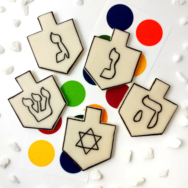 paint your own hanukkah dreidels flatlay