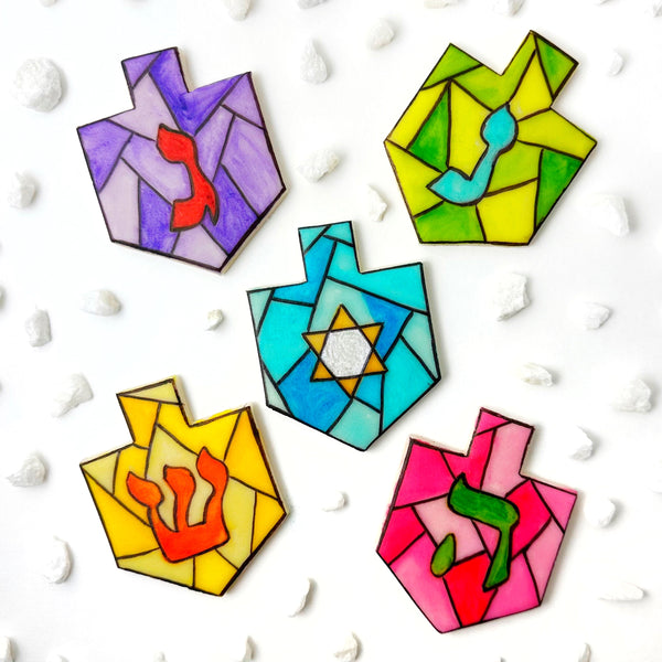 stained glass Hanukkah dreidels arranged