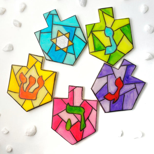 stained glass Hanukkah dreidels flatlay