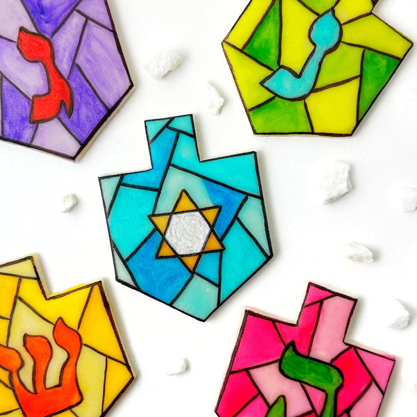 stained glass Hanukkah dreidels arranged