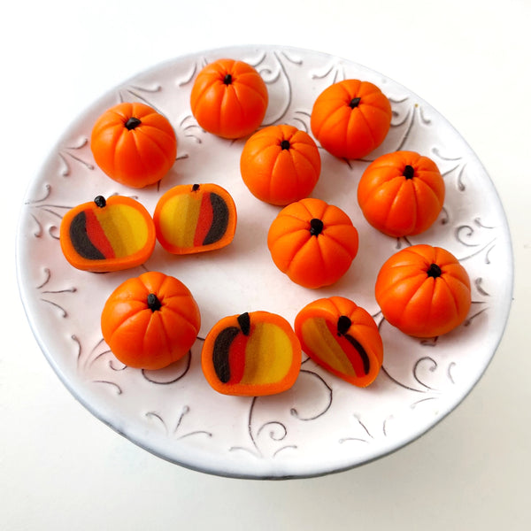 pumpkin fall marzipan truffles on a plate