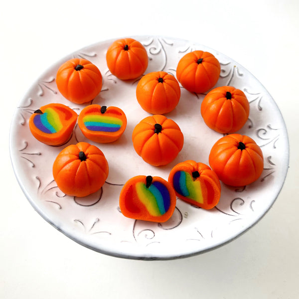 pumpkin rainbow marzipan truffles on a plate