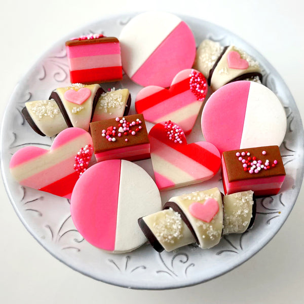 valentine's day cookie collection on a plate
