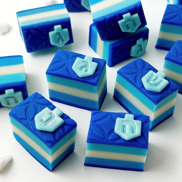 hanukkah striped dreidel cookies closeup