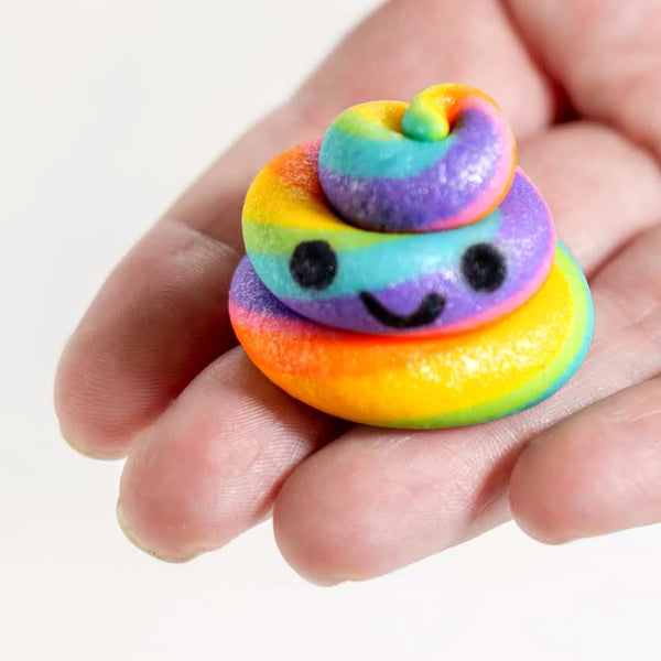 kawaii rainbow unicorn poop marzipan candy sculpture treats with happy faces close up