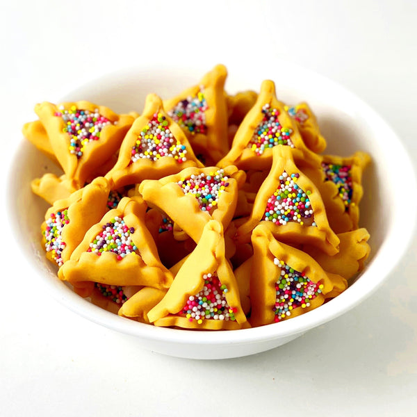 Purim vegan gluten-free purim sprinkle hamantaschen marzipan candy sculpture treats in a bowl