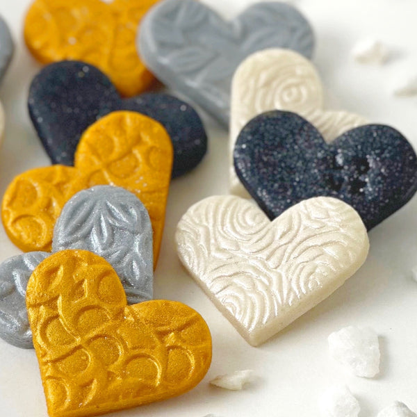 valentine's day elegant gold silver marzipan hearts closeup