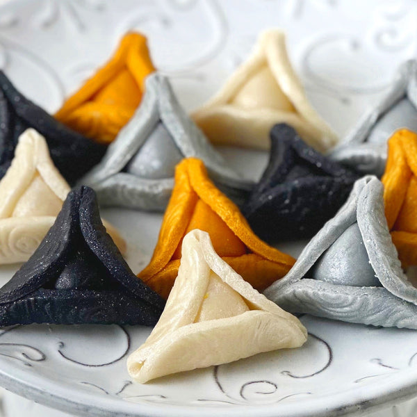 elegant purim gold hamantaschen closer