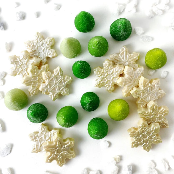 sparkly snowflakes and green trees marzipan candy sculpture treats top view