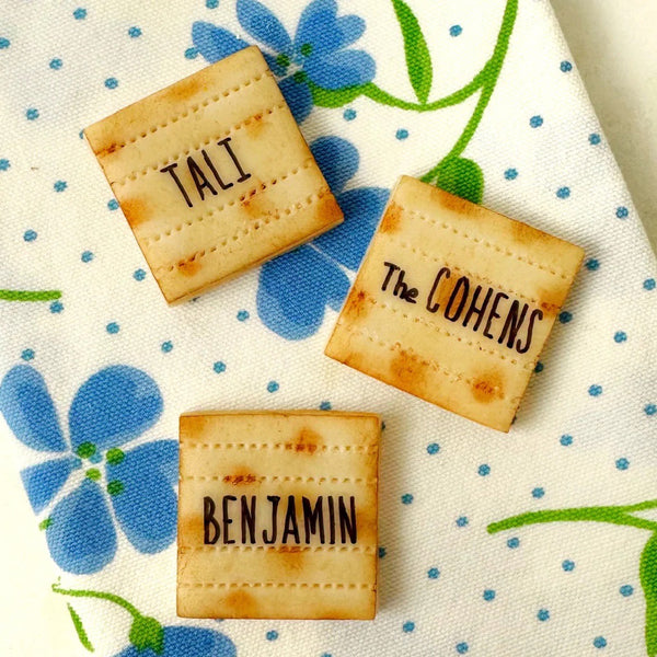 personalized marzipan matzah place settings on napkin closeup