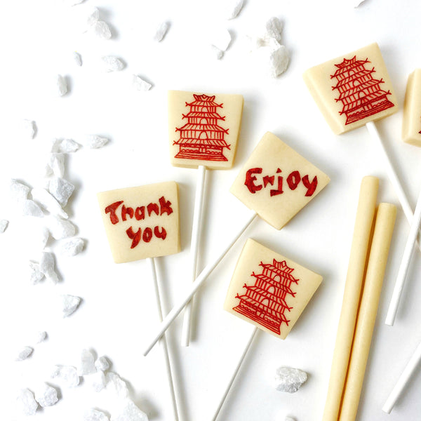 chinese takeout food boxes marzipan candy lollipops closeup