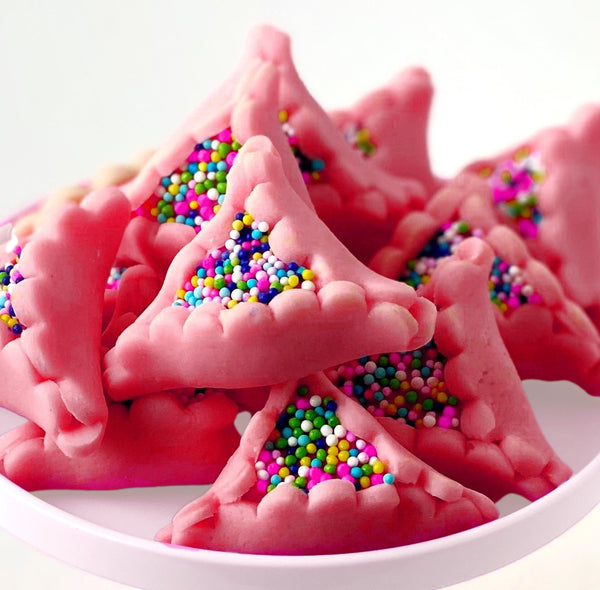 purim marzipan pink hamantaschen in a closeup