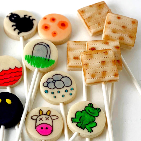 Passover Seder candy matzah ten plagues with frogs marzipan lollipops flat close up