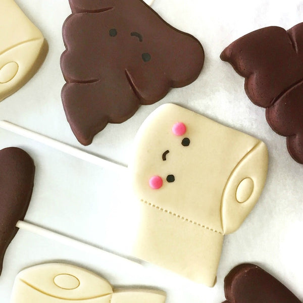 toilet paper & poop best friends marzipan candy lollipops close up