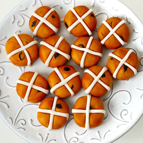 marzipan hot cross buns on a plate