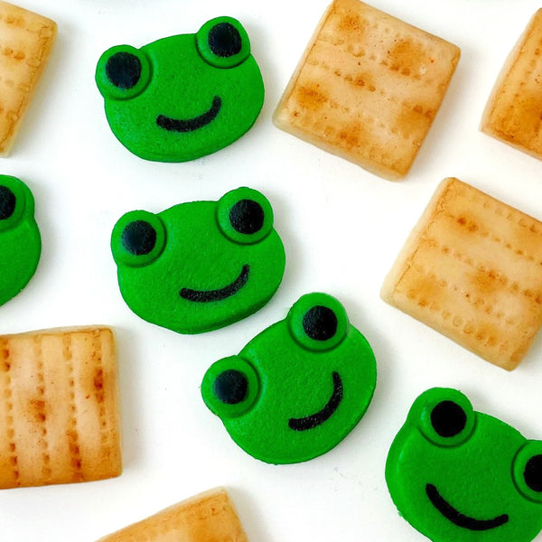 Passover matzah & green frogs mini marzipan candy bites closeup