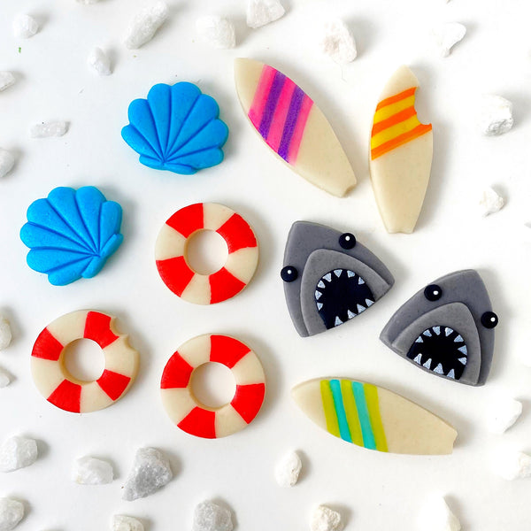 beach party favors shark week ideas marzipan candy cookies flatlay