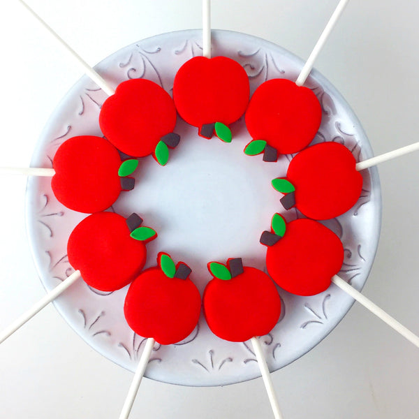 Rosh Hashanah red apples in a circle marzipan candy lollipops