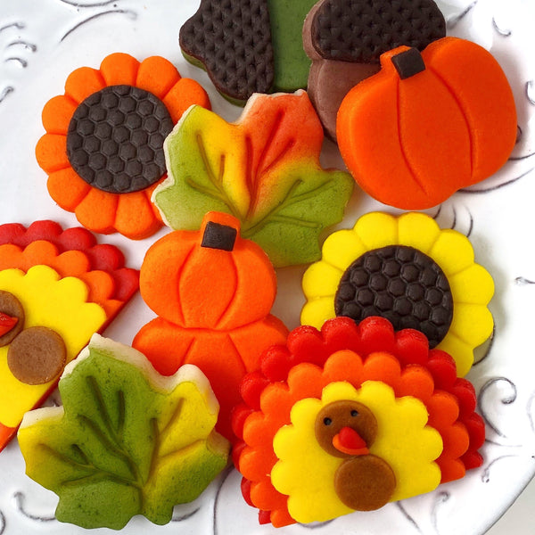 Thanksgiving pumpkin turkey acorn leaves sunflowers marzipan candy gift basket closeup