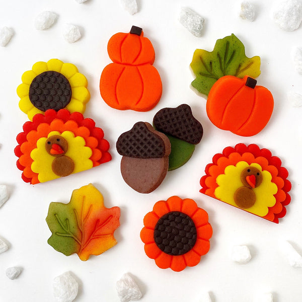 Thanksgiving pumpkin turkey acorn leaves sunflowers marzipan candy gift basket flatlay