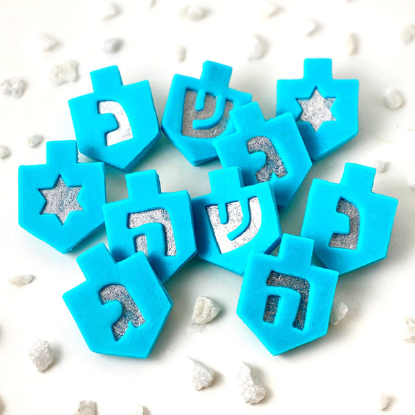 Hanukkah blue dreidel linzer marzipan gift flatlay