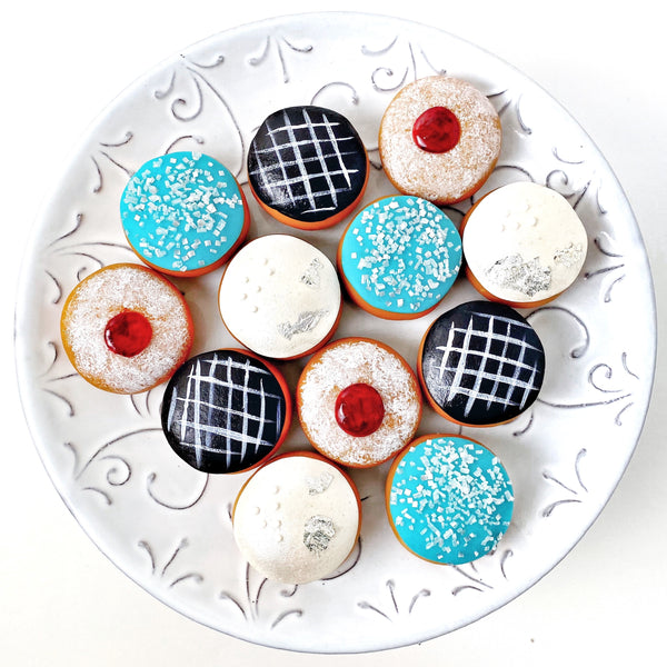Hanukkah Sufganiyot Donuts Marzipan Gift Box for the Festival of Lights on a plate
