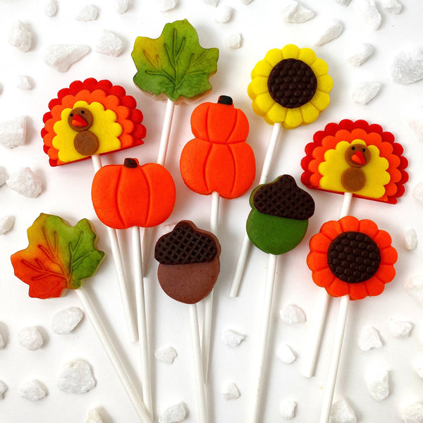 Thanksgiving collection with pumpkins, turkeys, sunflowers, maple leaves and acorns marzipan candy lollipops