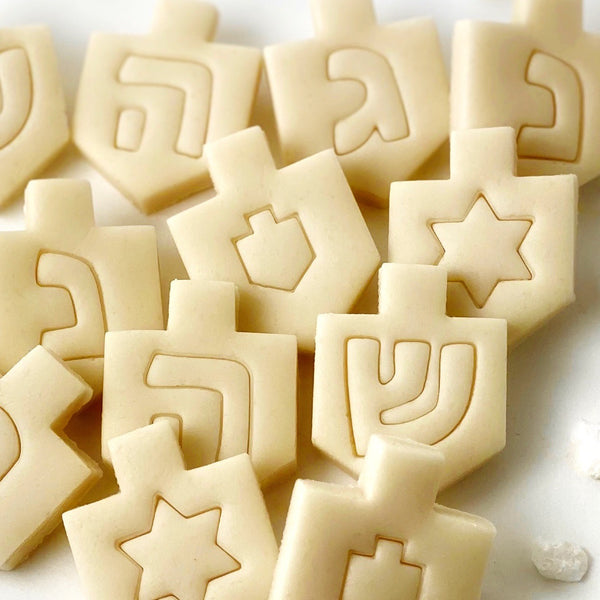 naked Hanukkah dreidel tiles closeup