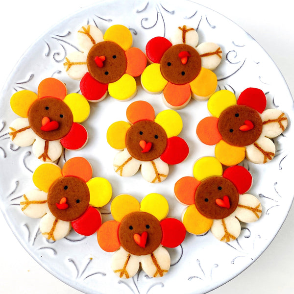 Thanksgiving turkey flowers marzipan candy tiles on a plate