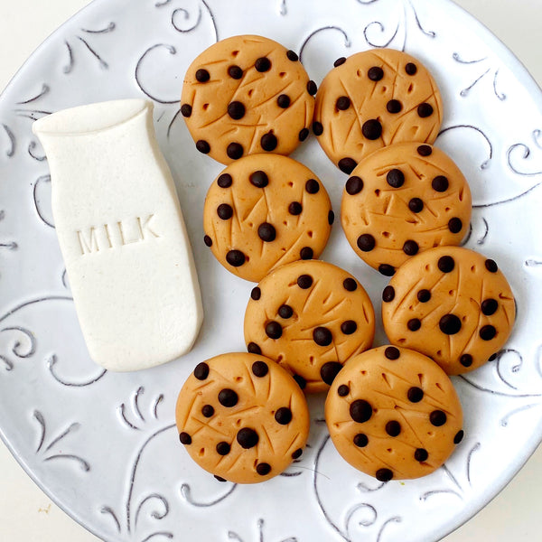 milk & cookie marzipan candy tiles on a plate