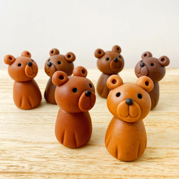 cutie teddy bear marzipan candy sculptures in a row