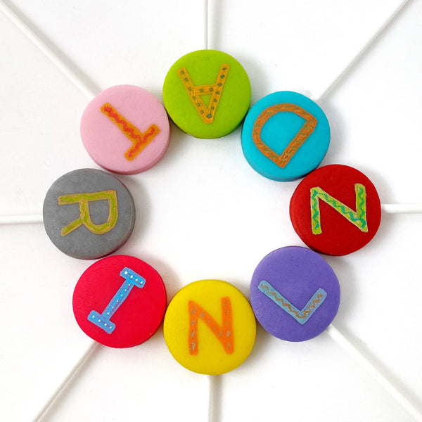 alphabet marzipan candy lollipops in a circle