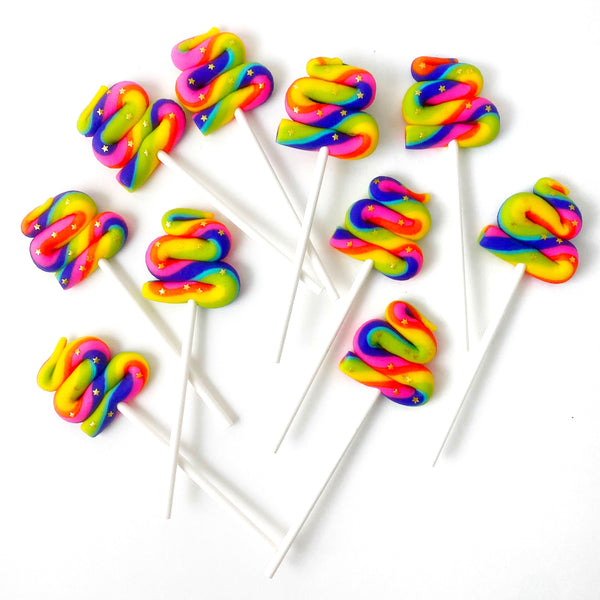 unicorn poop rainbow marzipan candy lollipops layout