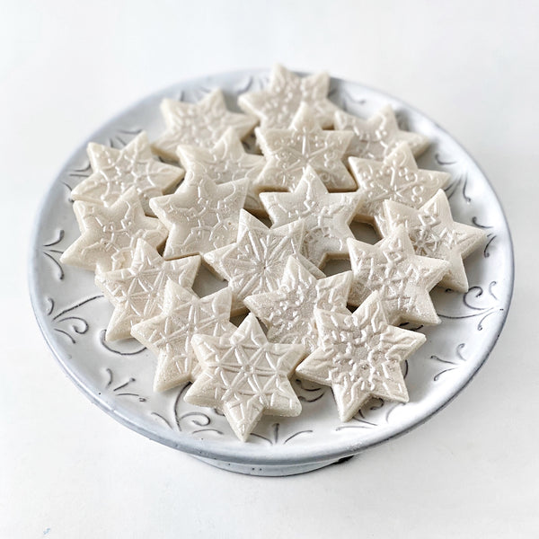 Hanukkah star of David snowflake candy tiles on a plate