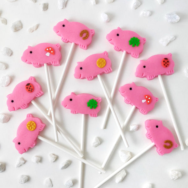 marzipan pigs Christmas glucksschwein pink candy lollipops for good luck flatlay