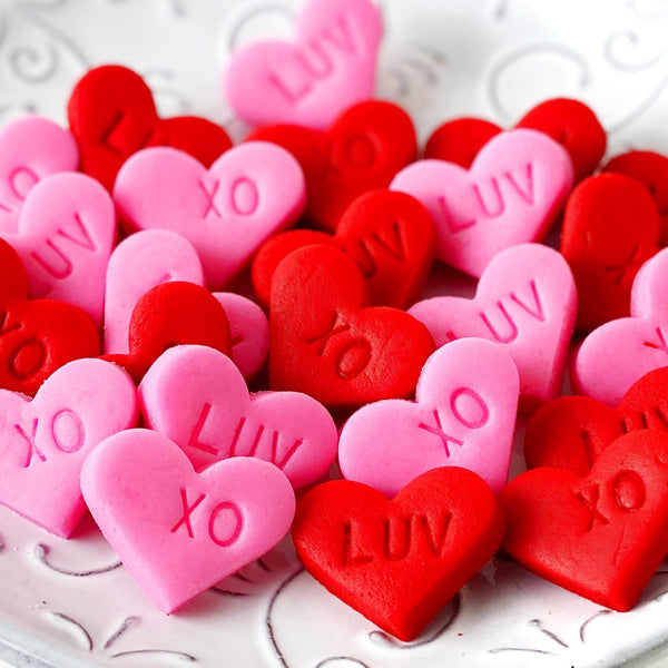 Valentine's Day pink & red hearts mini marzipan candy bites in a pile
