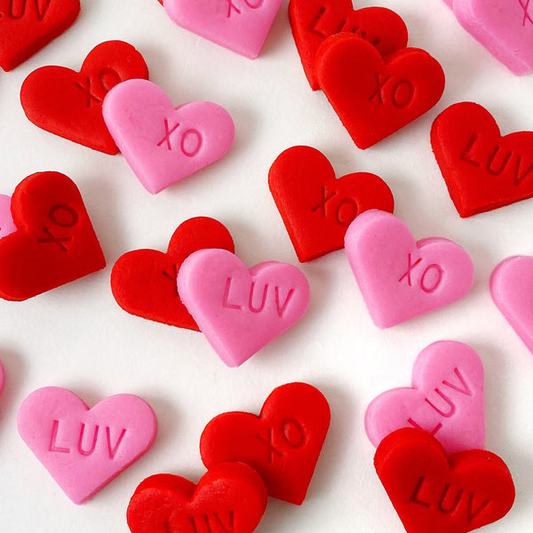 Valentine's Day pink & red hearts mini marzipan candy bites closeup