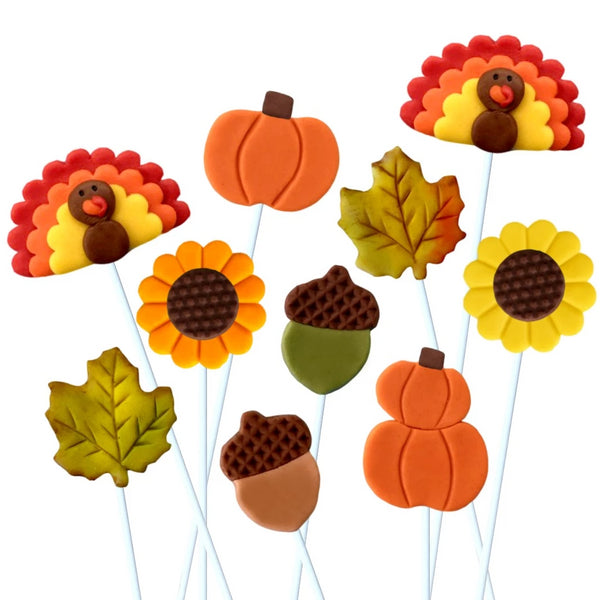 Thanksgiving collection with pumpkins, turkeys, sunflowers, maple leaves and acorns marzipan candy lollipops