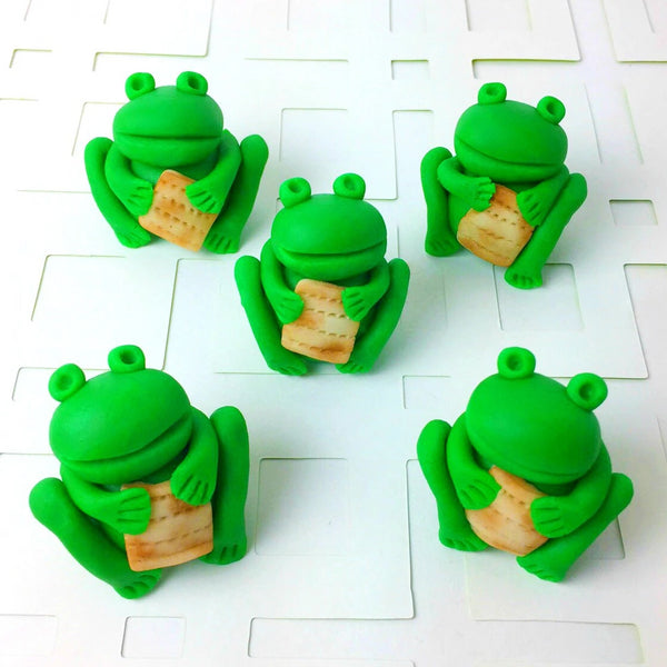Passover Seder frogs holding matzah array candy sculpture treats from the ten plagues