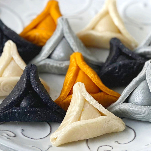 elegant purim gold hamantaschen closeup