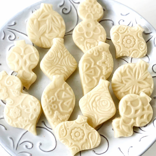 naked marzipan christmas ornaments closeup